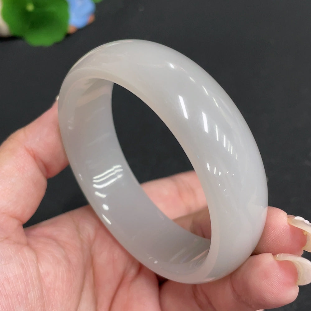 Huiliu Certified Hetian Jade Round Bracelet showcasing smooth, polished green jade beads on a delicate string.