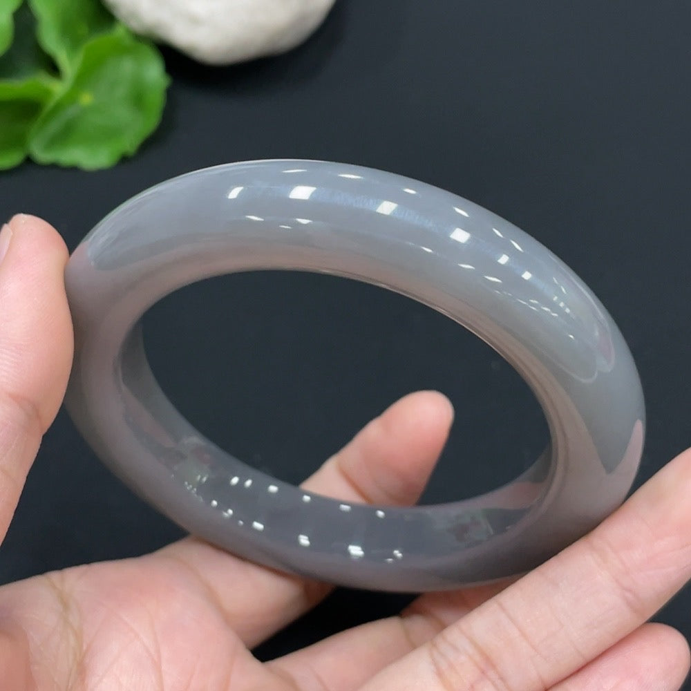 Huiliu Certified Hetian Jade round bracelet showcasing smooth, polished jade beads on a delicate string.