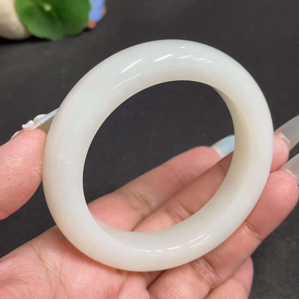 Huiliu HQ Hetian Jade round bracelet, certified jade jewelry with smooth, polished round beads on a delicate string.