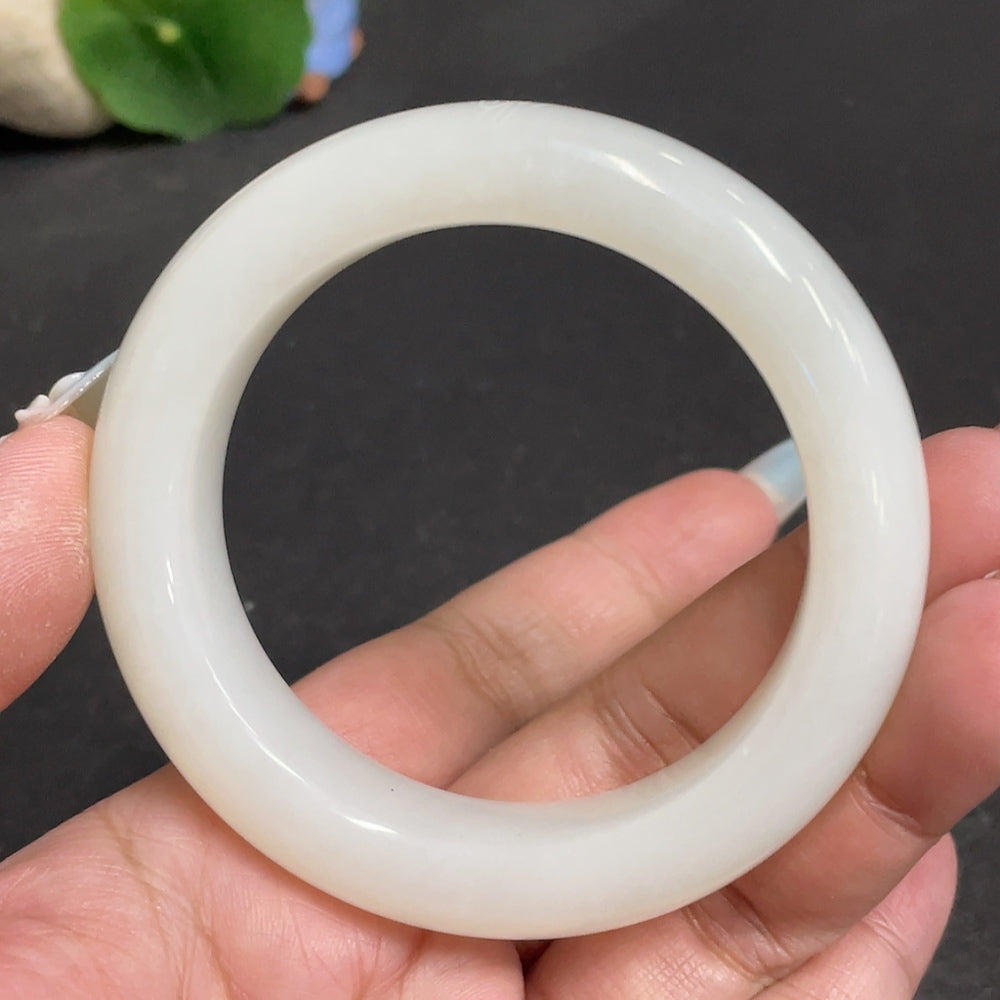 Huiliu certified Hetian jade round bracelet featuring smooth, polished green jade beads on a delicate string.
