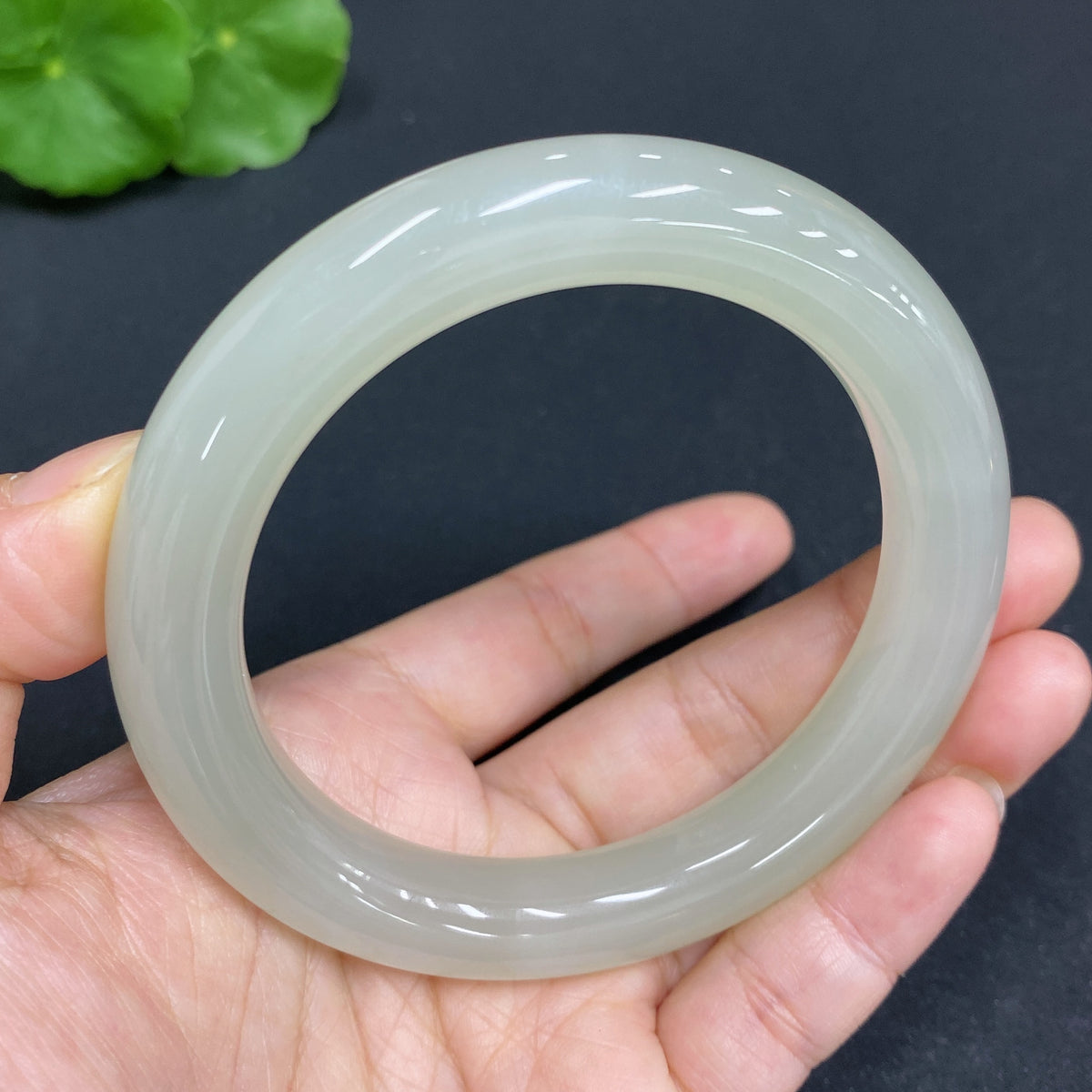 Huiliu HQ Hetian Jade round bracelet featuring smooth, polished green jade beads, certified by Huiliu for quality and authenticity.