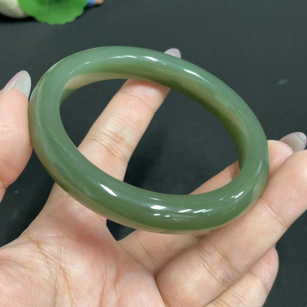 Huiliu HQ Hetian Jade round bracelet, certified Huiliu jade, featuring smooth, polished jade beads on a delicate elastic band.