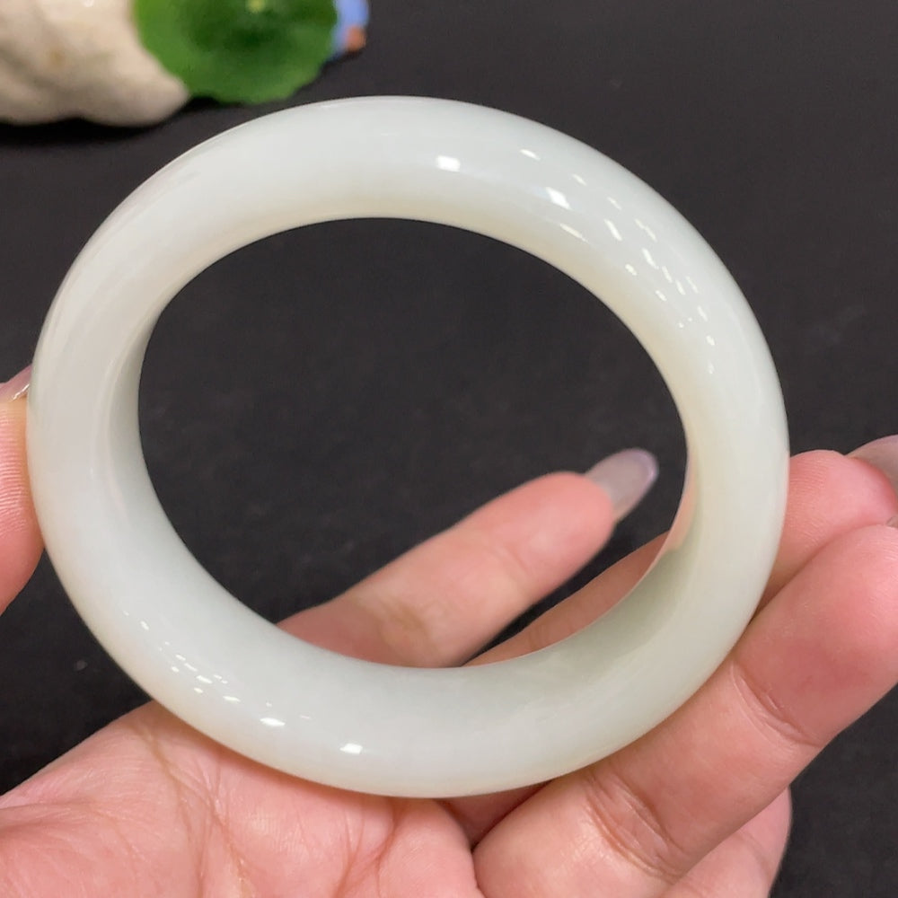 Huiliu Certified Hetian Jade Round Bracelet featuring smooth, polished jade beads on a delicate string for elegant wear.