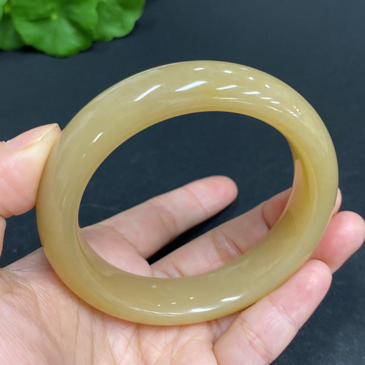 Huiliu HQ Hetian Jade round bracelet, size 56.8, approximately 68.3g, featuring smooth jade beads on a natural jewelry display.
