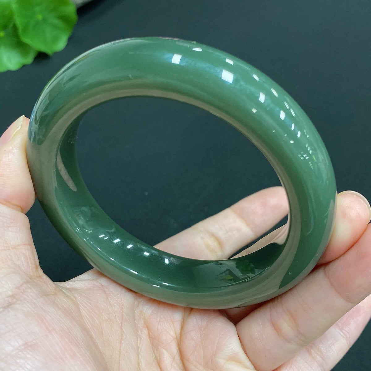 Hetian Jade round bracelet by HUILIU HQ, size 56.8 with approximately 76.3g weight, showcasing smooth, polished jade beads.