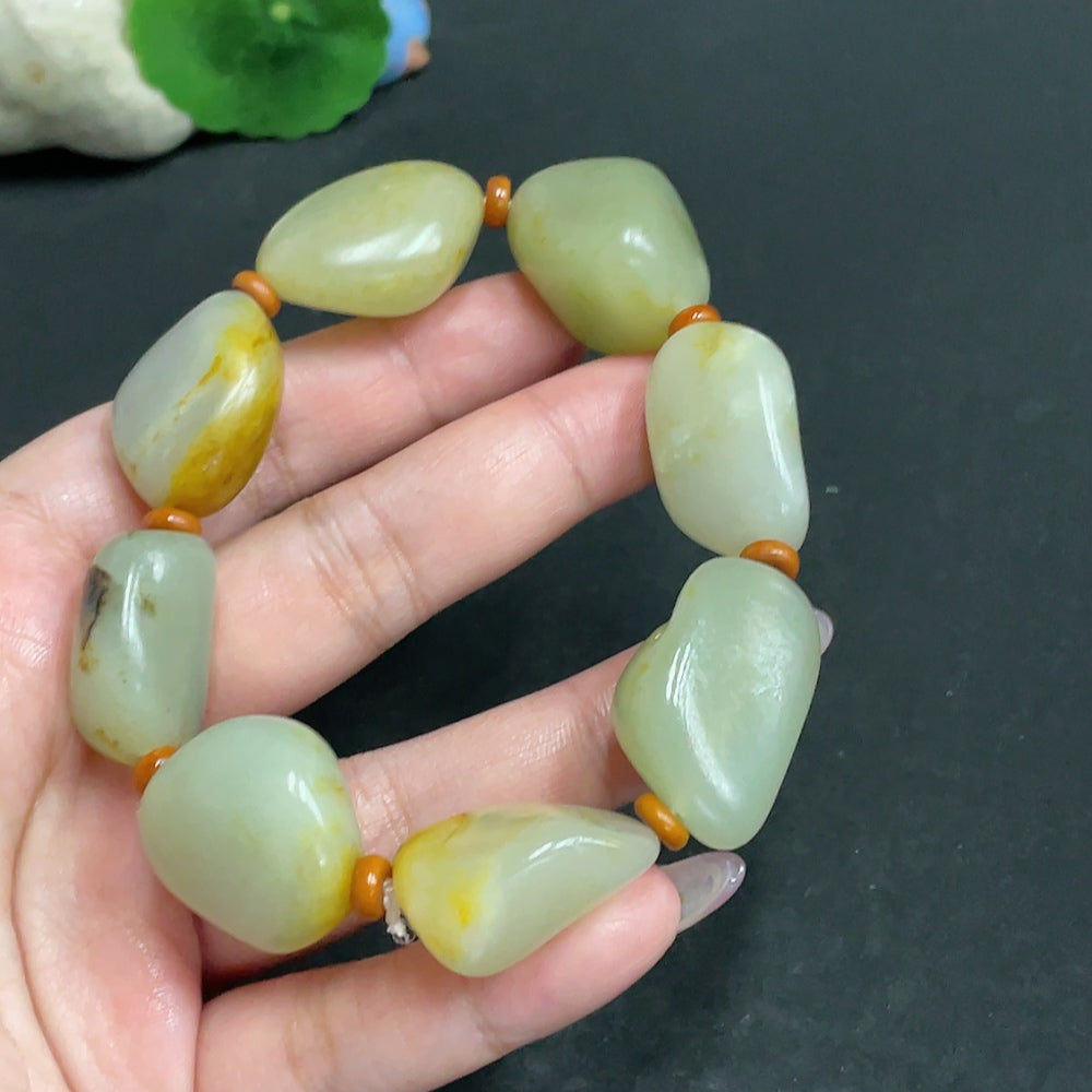 Hetian jade seed material bracelet by HUILIU HQ featuring natural formation and weighing approximately 99.3g, with undetermined skin color.
