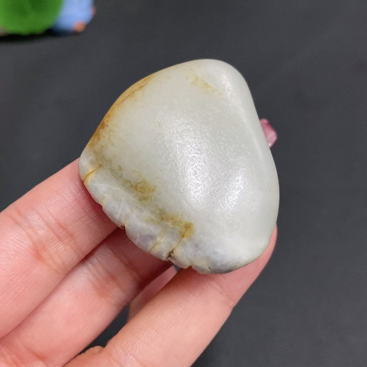Hetian Jade from HUILIU HQ, natural undetermined skin color, weighing approximately 51.1g, showcasing smooth jade craftsmanship.