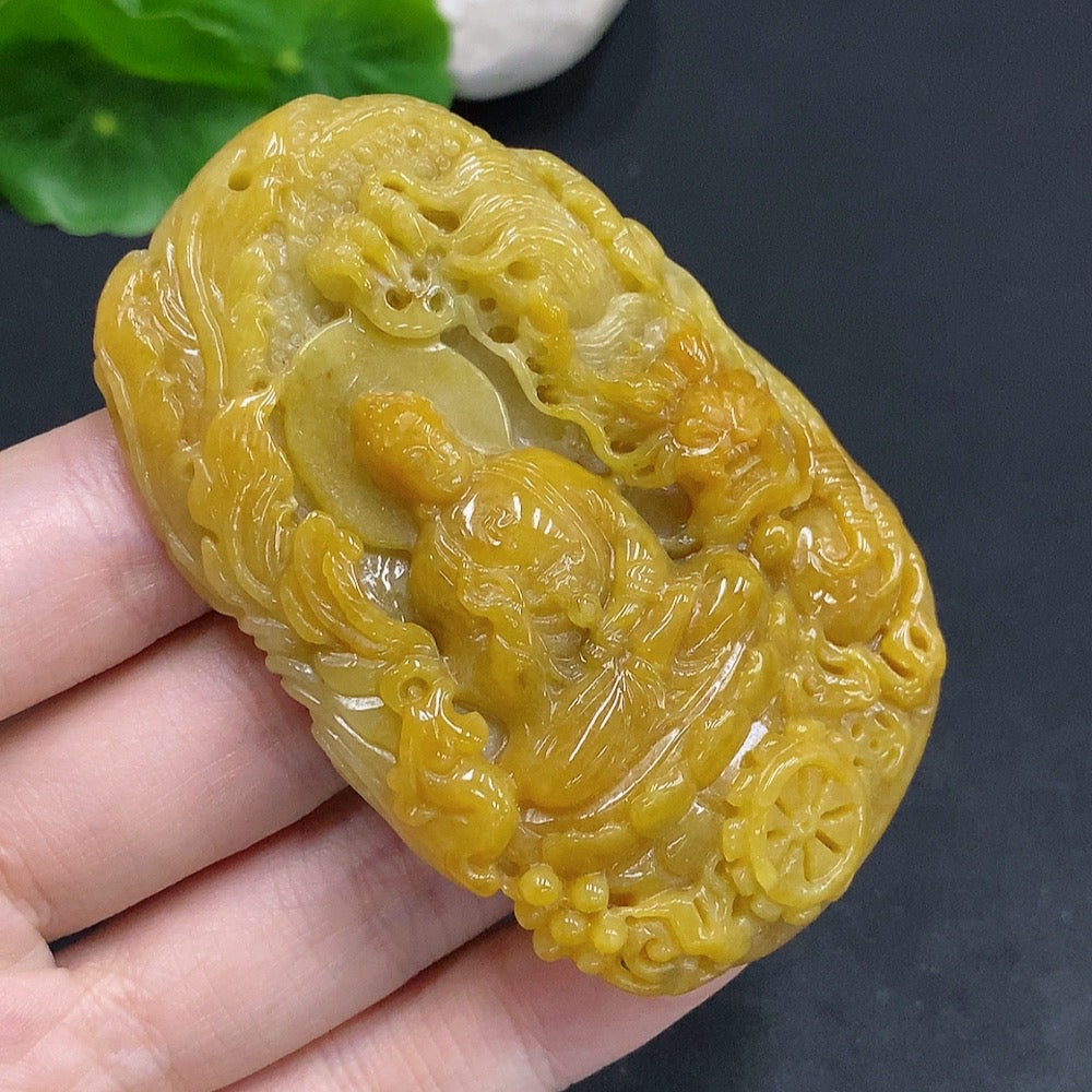 Natural jadeite Amitabha pendant from HUILIU HQ featuring a smooth, polished jadeite Buddha figure on a cord.