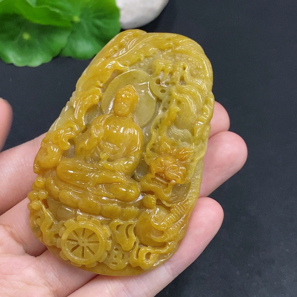 Jadeite Amitabha pendant from HUILIU HQ featuring a carved jade Buddha figure on a smooth jade pendant.