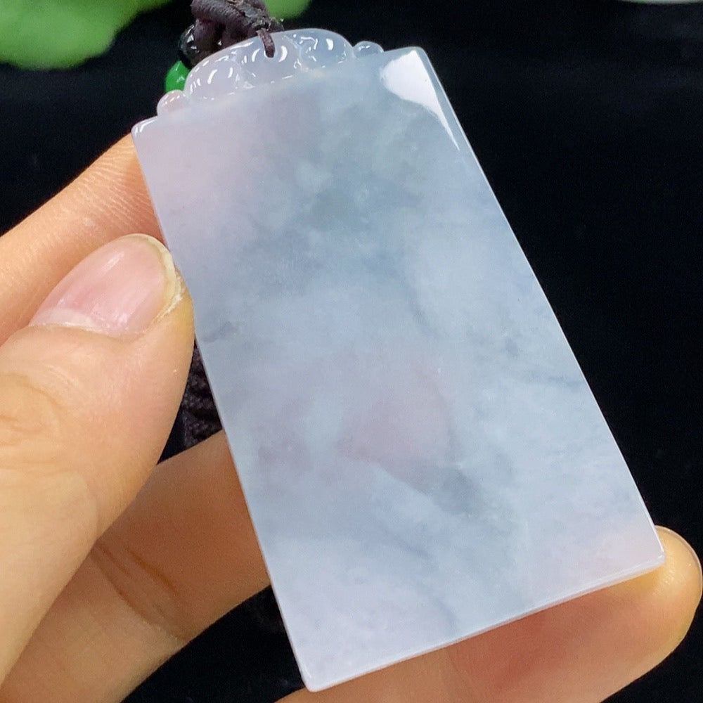 Antique jadeite pendant featuring intricate carvings, crafted by HUILIU HQ, showcasing traditional jade jewelry craftsmanship.