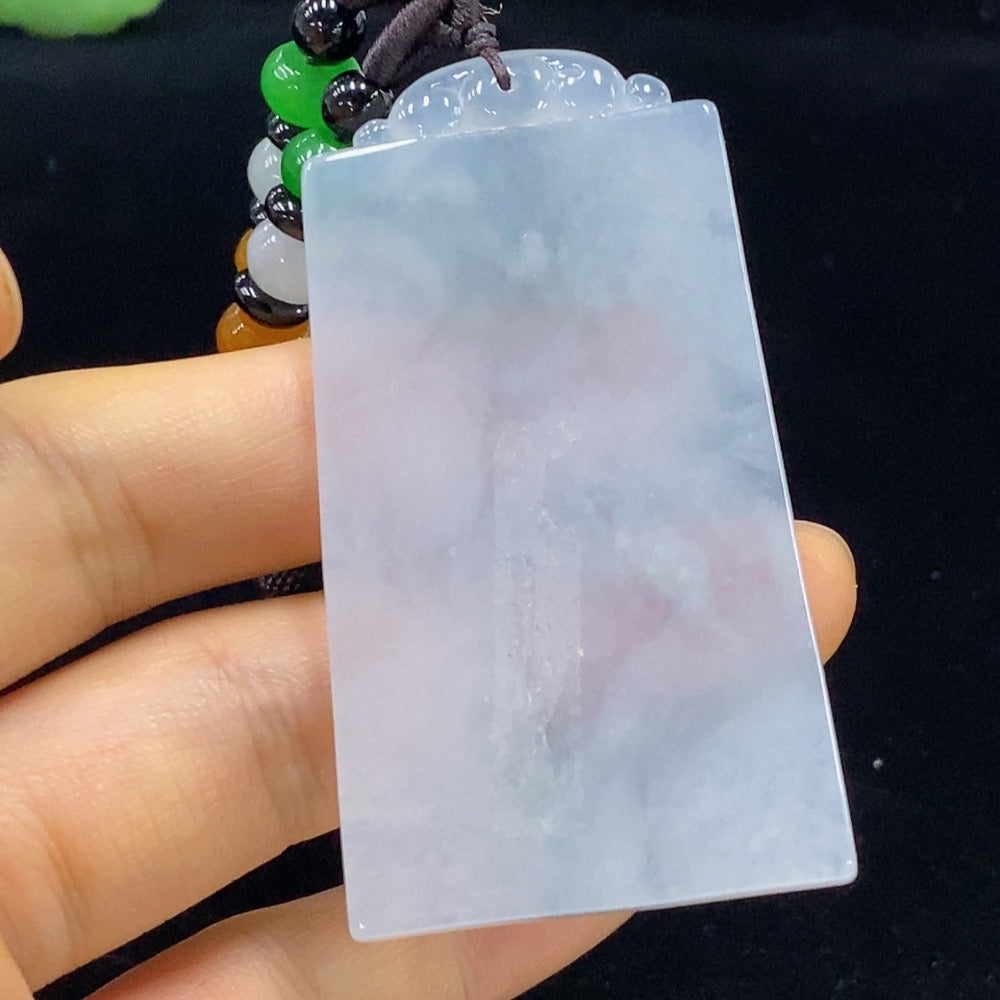 Antique jadeite pendant from HUILIU HQ featuring intricate carvings and a polished jade surface, showcasing traditional craftsmanship.