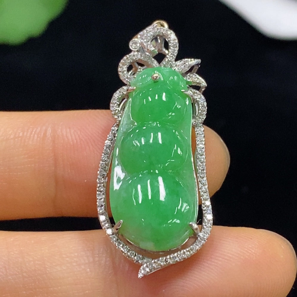 Jadeite Auspicious Bean Pendant with 18k gold accents and diamond details, showcasing the elegant jade jewelry design.