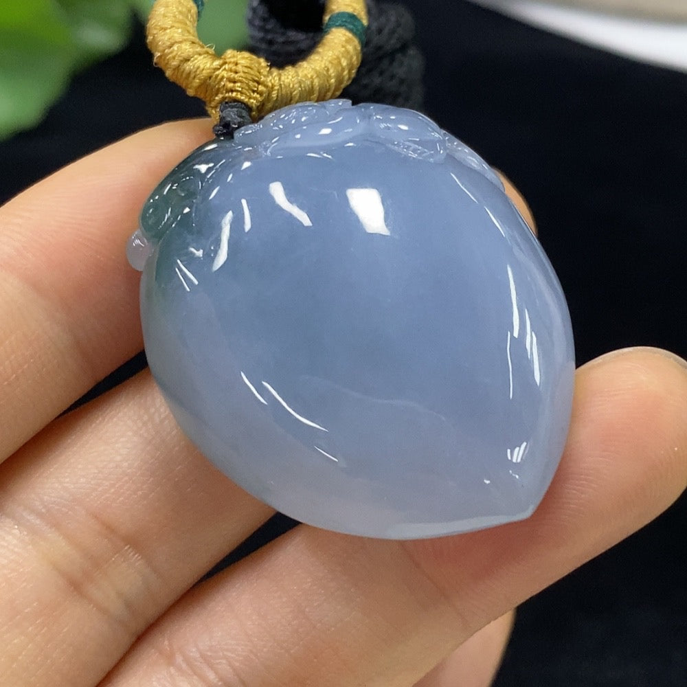 Jadeite "Auspicious Monkey Offering Longevity" pendant by HUILIU HQ featuring a detailed carved monkey design on smooth jade.