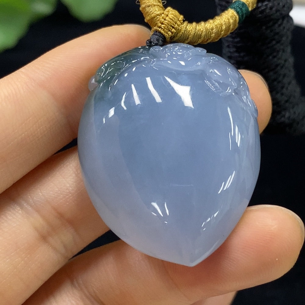 Jadeite "Auspicious Monkey Offering Longevity" pendant with intricate carvings, crafted by HUILIU HQ, showcasing traditional jade artistry.