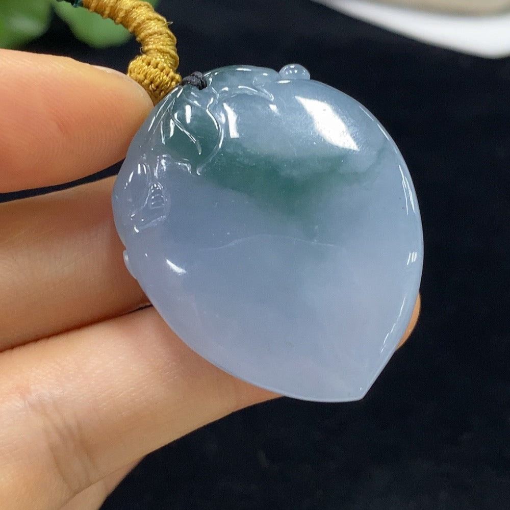 Jadeite "Auspicious Monkey Offering Longevity" pendant from HUILIU HQ, featuring a detailed jade monkey design on a smooth jade surface.