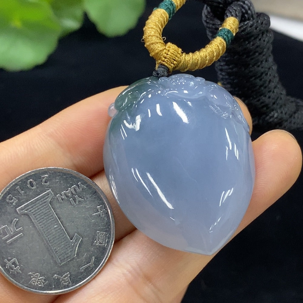 Jadeite "Auspicious Monkey Offering Longevity" pendant by HUILIU HQ featuring detailed carved monkey design on green jade pendant.
