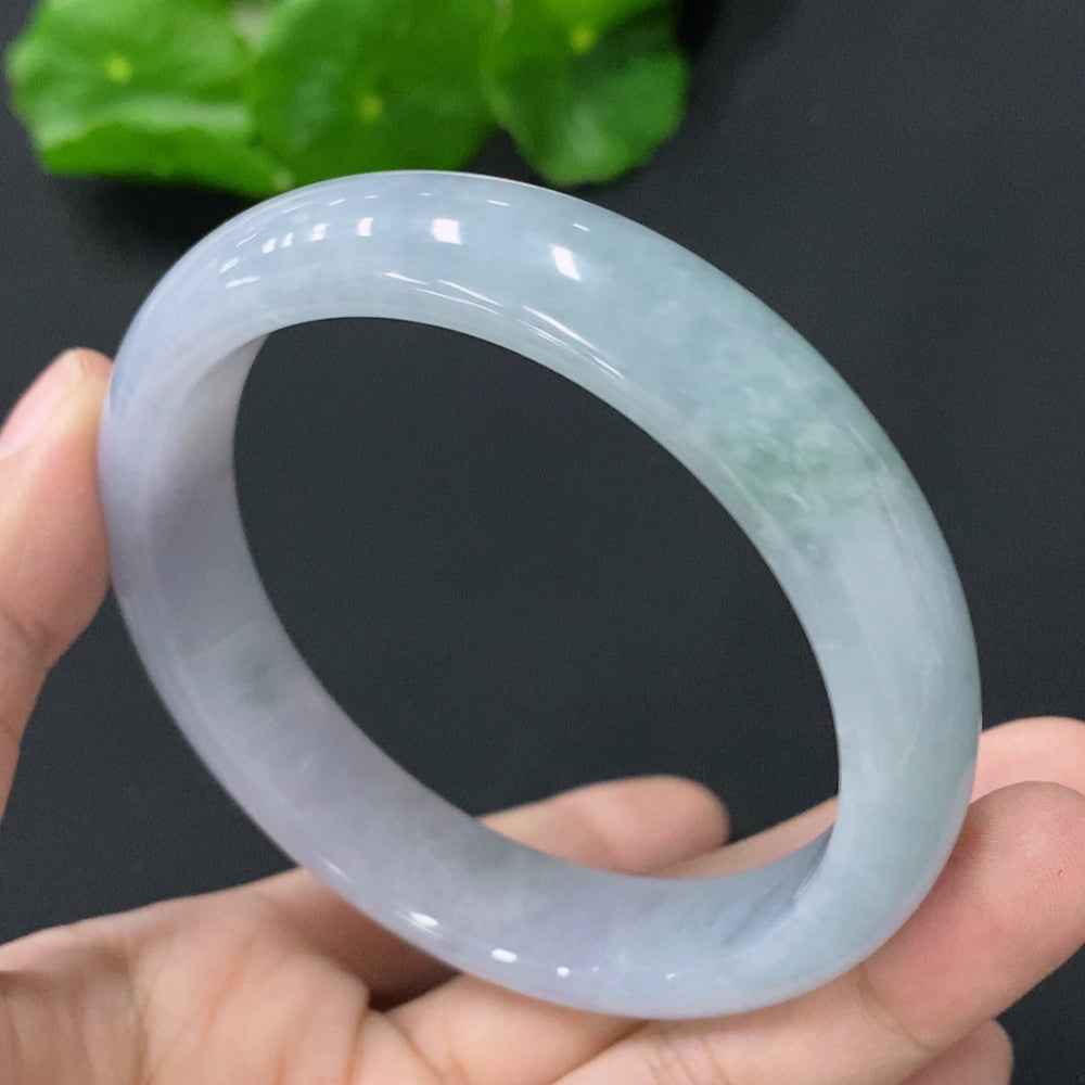 HUILIU HQ jadeite bangle in size 56.8mm, weighing 53.321g, featuring smooth, polished jade surface with natural green hues.