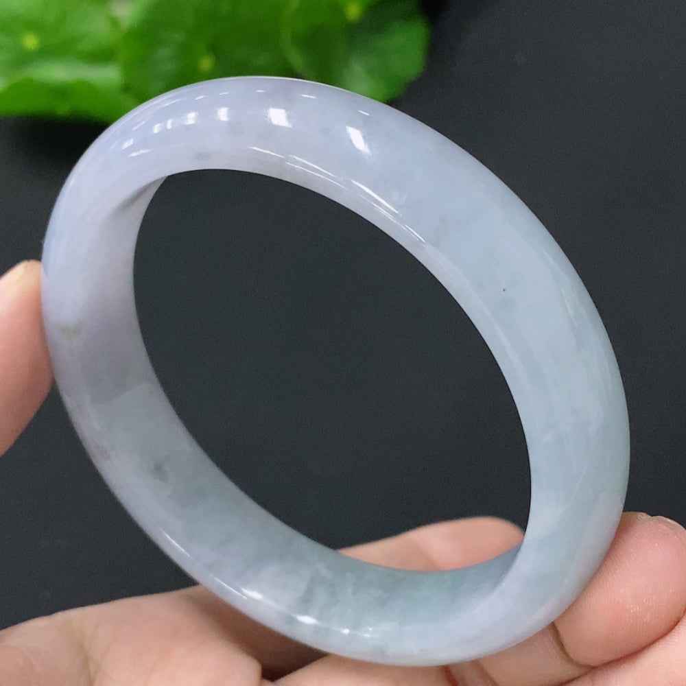 HUILIU HQ jadeite bangle, size 56.8mm, weighs 53.321g, showcasing smooth, polished green jade surface and elegant round shape.