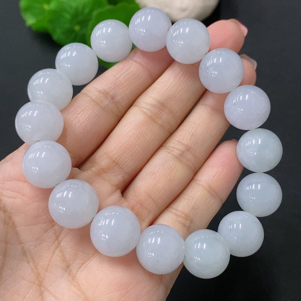 HUILIU HQ jadeite bead bracelet with 13.5mm beads, showcasing smooth, polished jade stones on a neutral background.