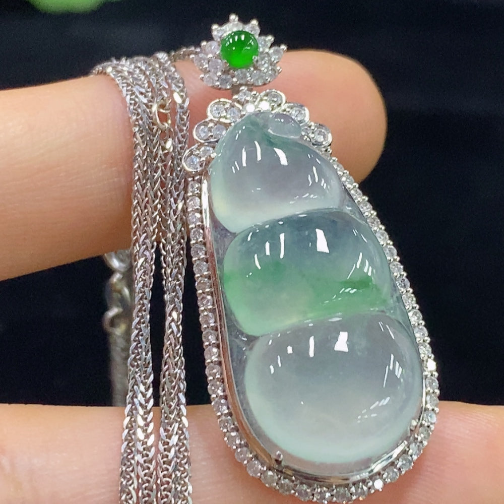 HUILIU HQ jadeite bean inlay piece with 18K gold and diamond accents, includes chain, weighs approximately 10.35g.