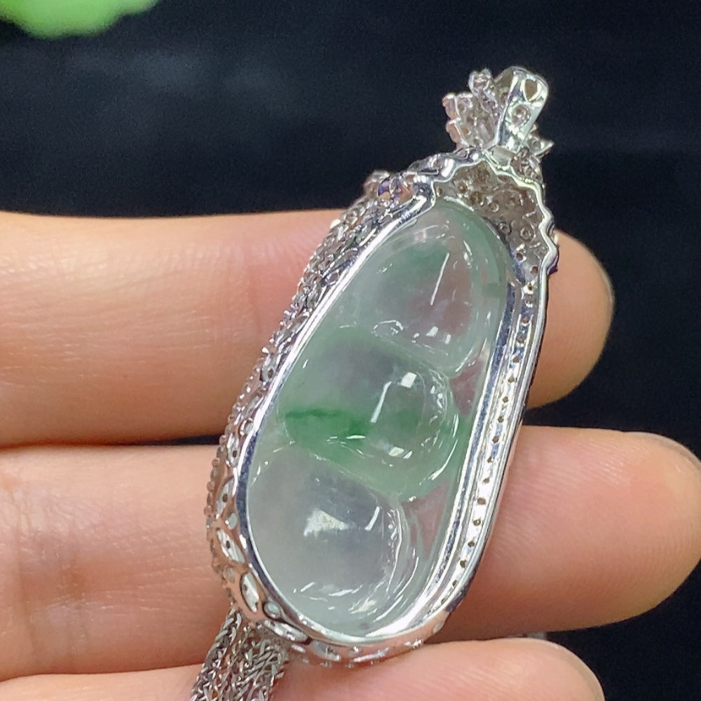 Jadeite bean inlay piece by HUILIU HQ with 18K gold accents, diamond details, and included chain, weighing approximately 10.35g.