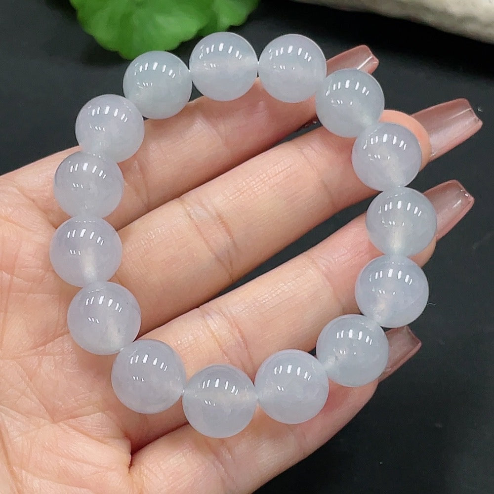 HUILIU HQ jadeite bracelet with 12.2mm beads, approximately 47.56g, showcasing smooth, polished green jade stones.