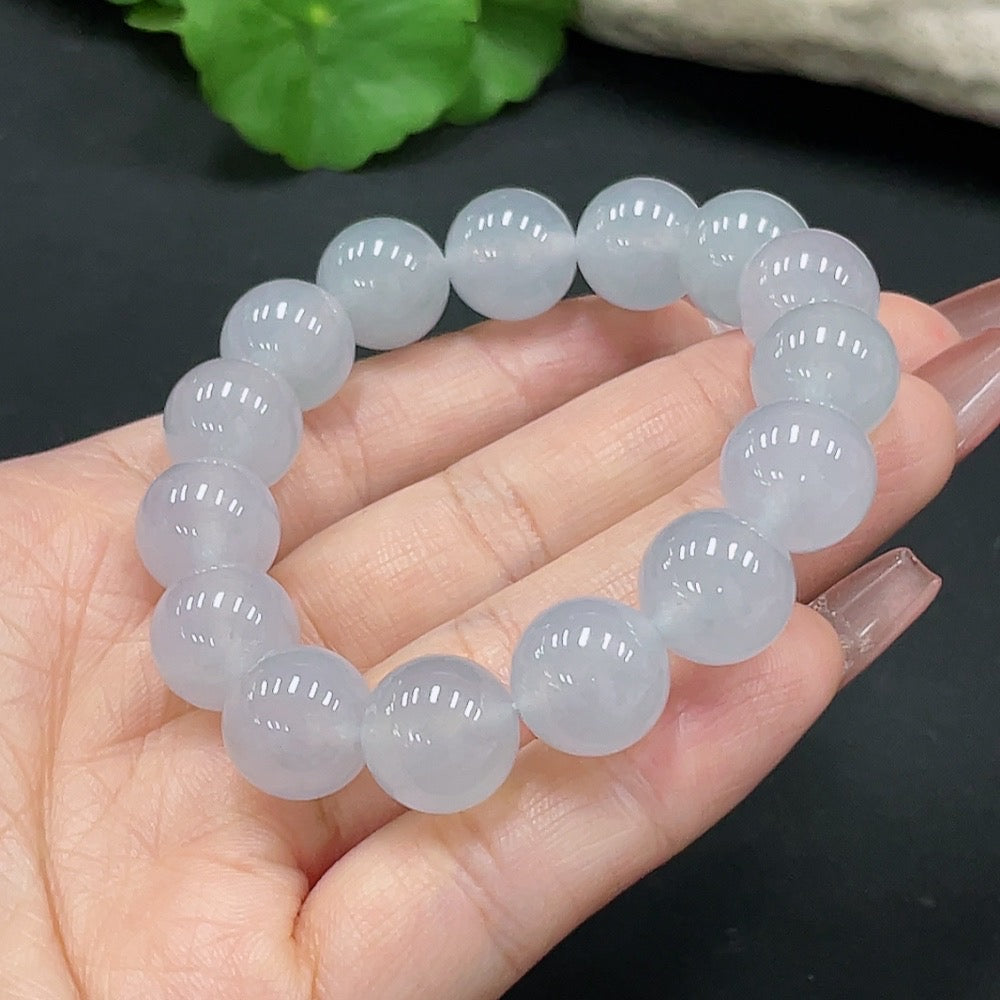 HUILIU HQ jadeite bracelet with 12.2mm beads, crafted from smooth green jade, weighs approximately 47.56g.