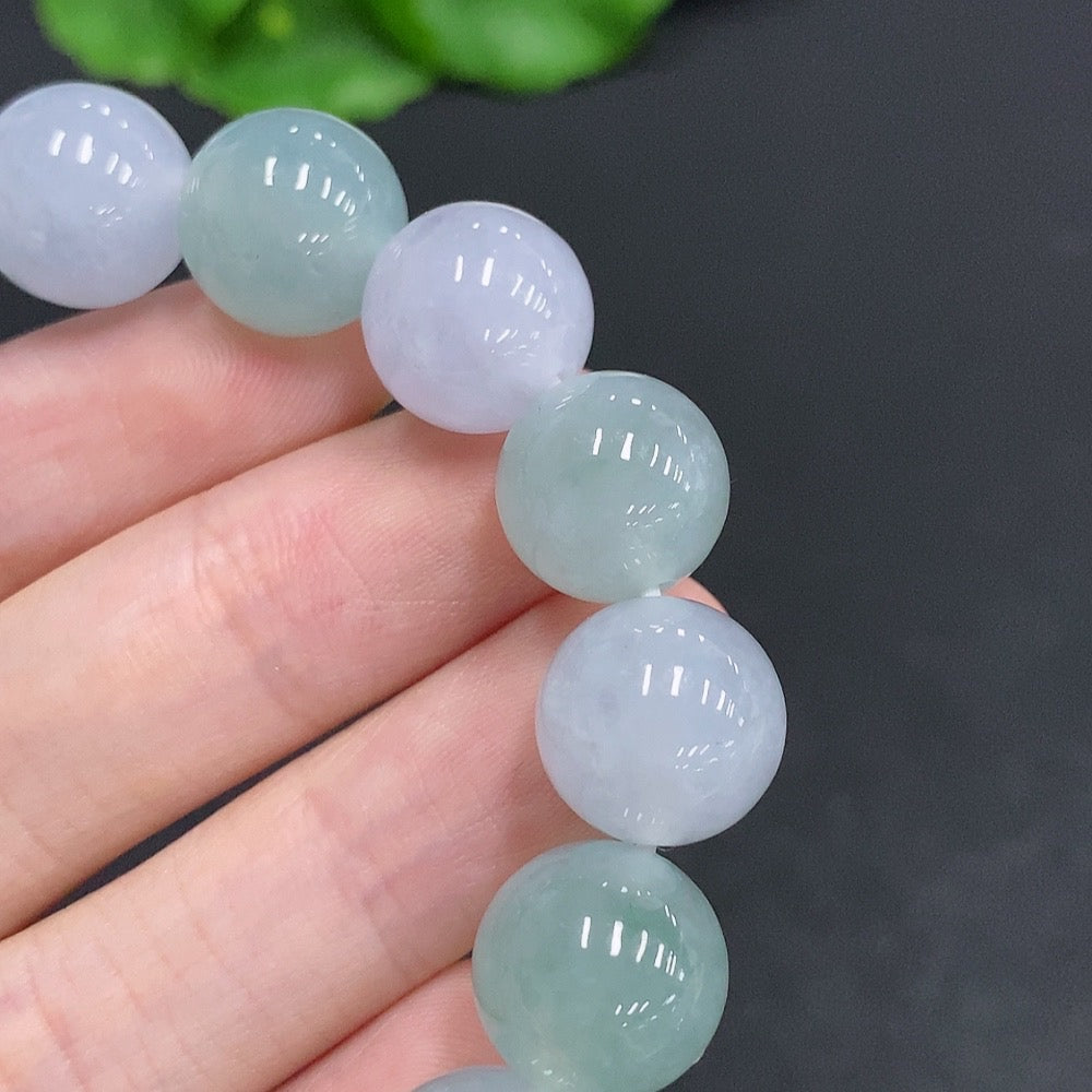 HUILIU HQ jadeite bracelet, approx. 12.3mm wide, featuring smooth jade stones, weighs about 51g, showcasing elegant jade jewelry.