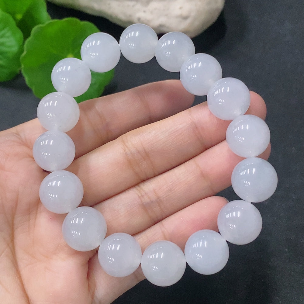 HUILIU HQ jadeite bracelet with 12.5mm beads, total weight 51.96g, showcasing smooth green jade stones on a neutral background.