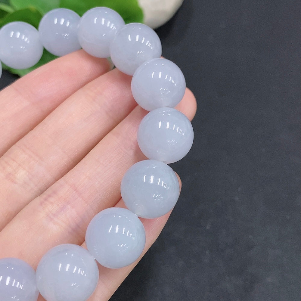 Huiliu HQ jadeite bracelet weighing approx. 67.4g with 13.3mm size, featuring polished green jade stones.