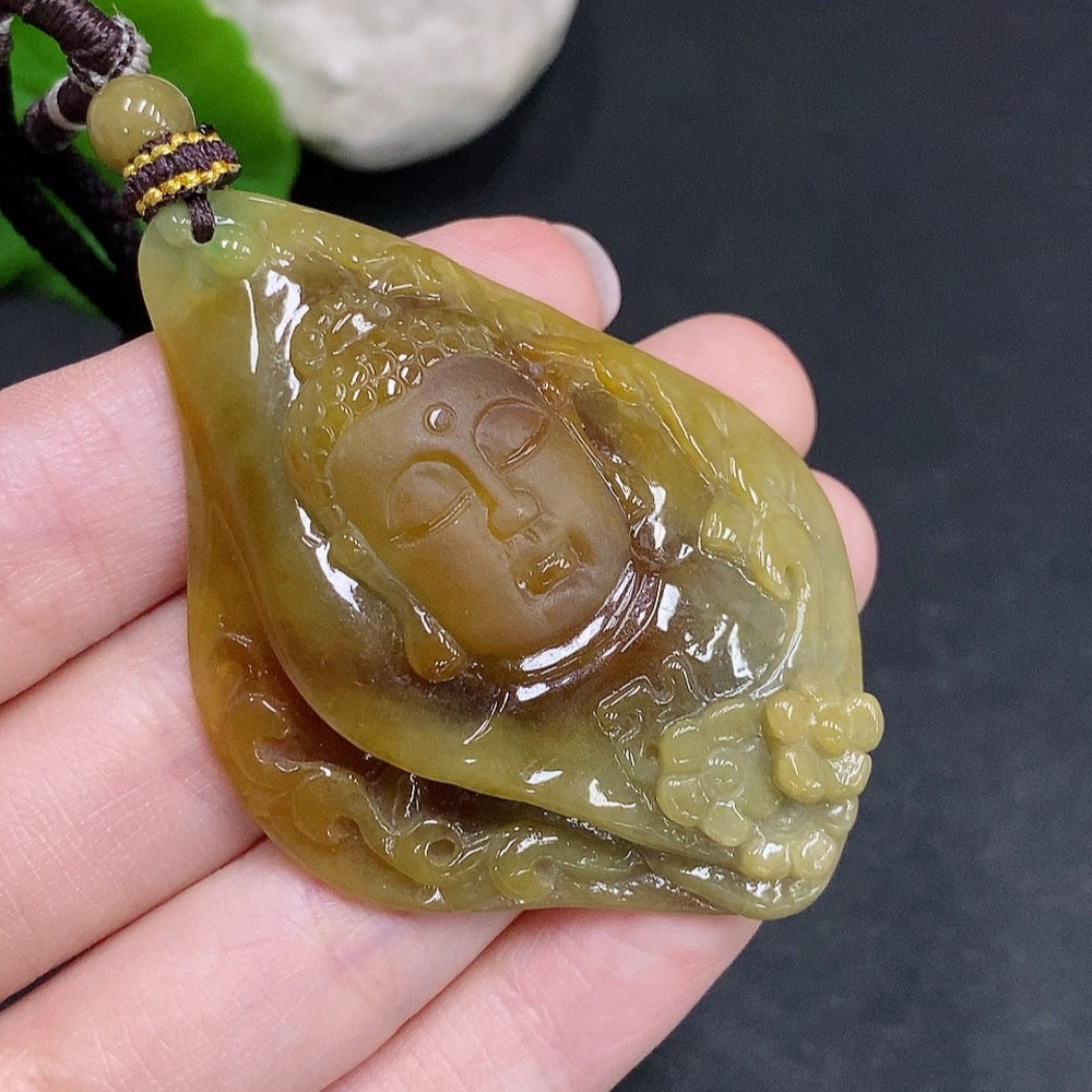 Jadeite Buddha flower pendant from HUILIU HQ showcasing a detailed carved Buddha figure on a smooth jade pendant.