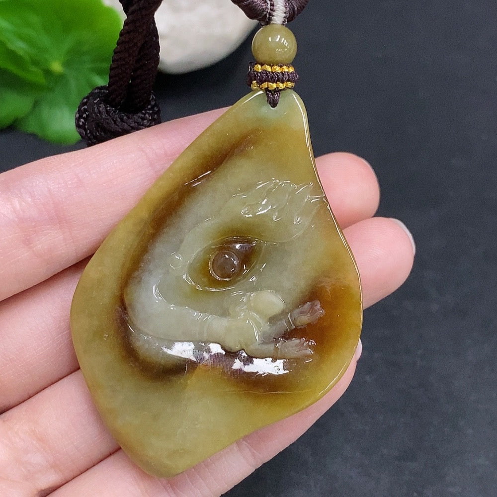 Jadeite Buddha flower pendant by HUILIU HQ featuring a detailed carved Buddha figure on a smooth jade pendant.