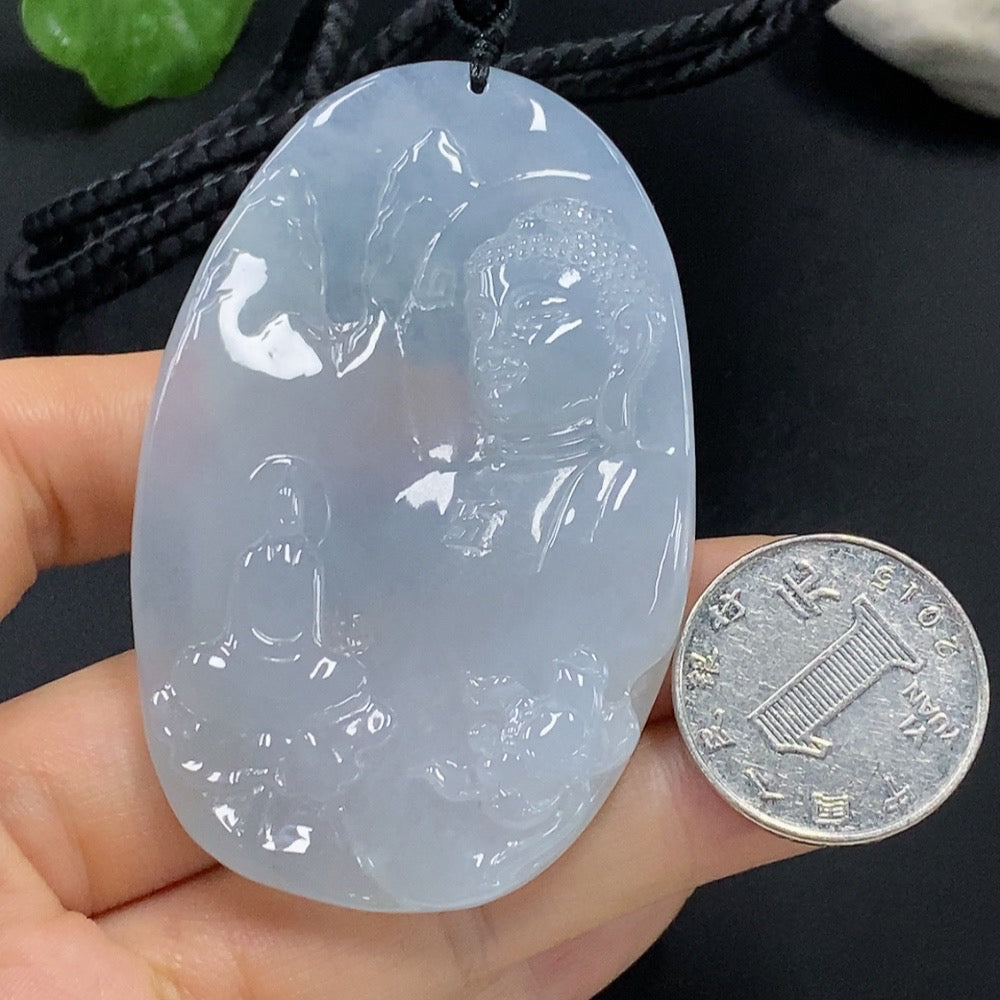 Jadeite Buddha observing the world pendant with detailed carving, natural green jade, and smooth polished surface.