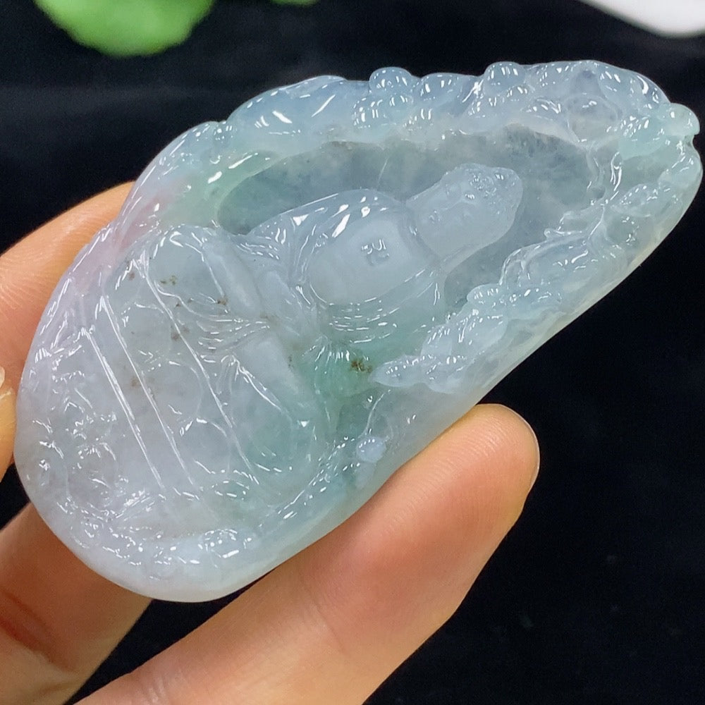 HUILIU HQ jadeite Buddha pendant weighing approximately 30.19g, featuring detailed carved Buddha design on smooth jade surface.