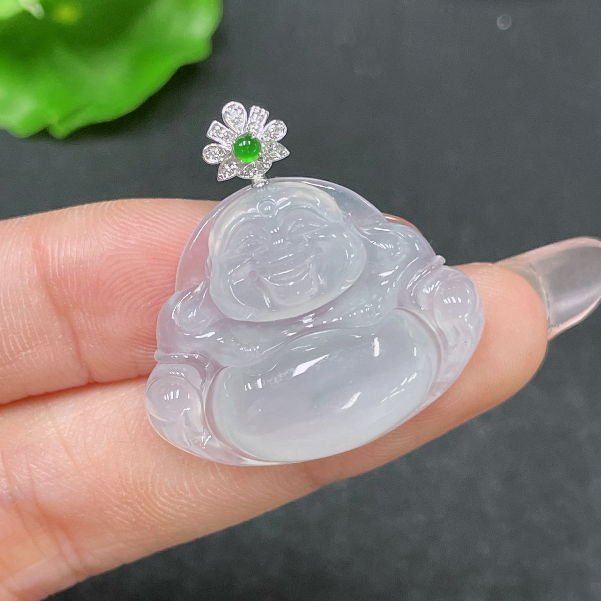 Jadeite Buddha pendant by HUILIU HQ featuring 18K gold accents and diamond details, weighing approximately 6.23g.