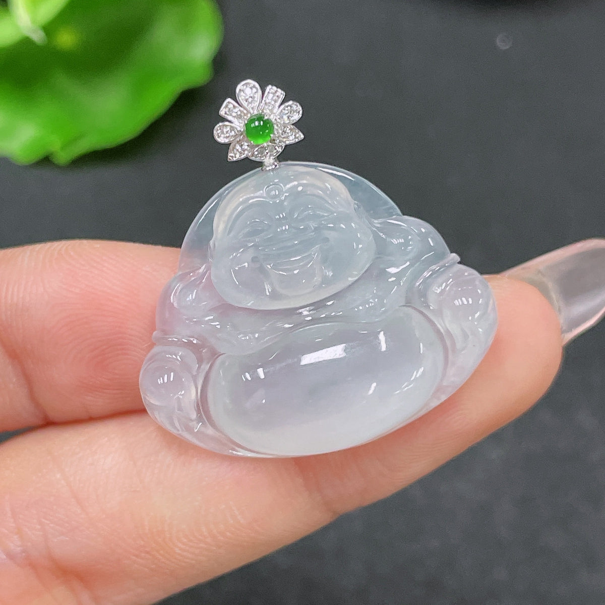 Jadeite Buddha pendant by HUILIU HQ with 18K gold accents and diamond details, weighing approximately 6.23g.