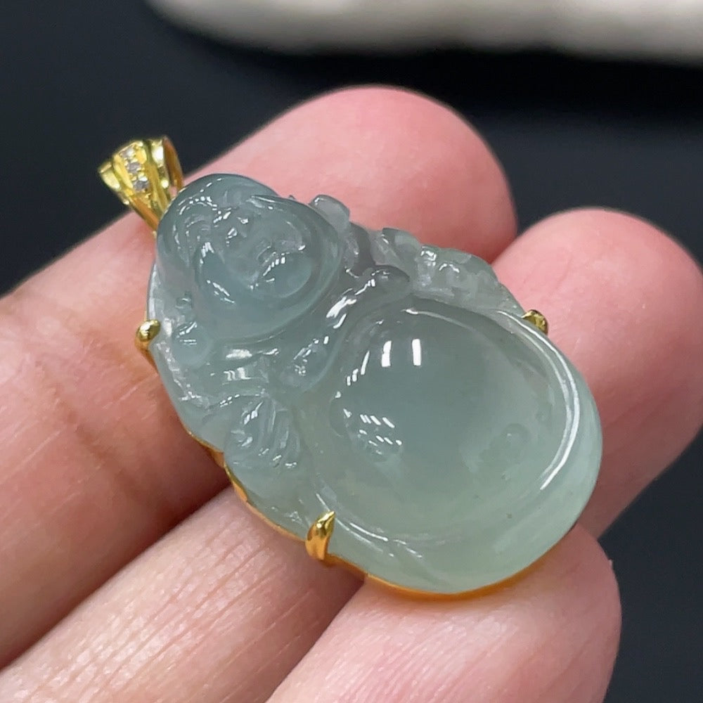Jadeite Buddha pendant with 18k gold setting, crafted from green jade, weighing approximately 6.04 grams, by HUILIU HQ.
