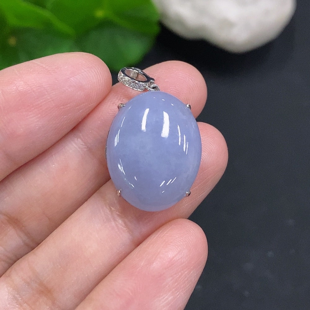 HUILIU HQ jadeite cabochon pendant with diamond accents, set in 18k gold, weighing approximately 4.7 grams.