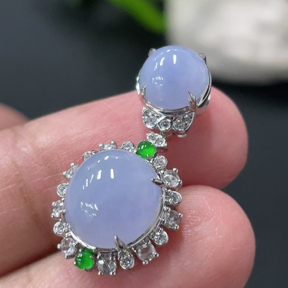 Jadeite cabochon pendant with 18K gold and diamond accents, showcasing a polished green jade stone with elegant gold and diamond details.