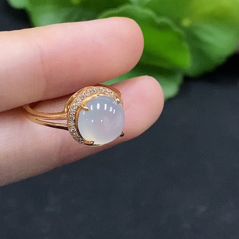 Huiliu HQ jadeite cabochon solitaire ring with diamond accents, featuring a smooth green jade gemstone on a silver band.