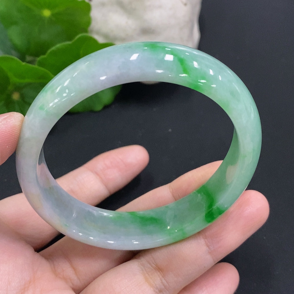 Broken jadeite concubine bracelet by HUILIU HQ, size 58/50.7, weighs approx. 49.1g, with visible damage and cracks.