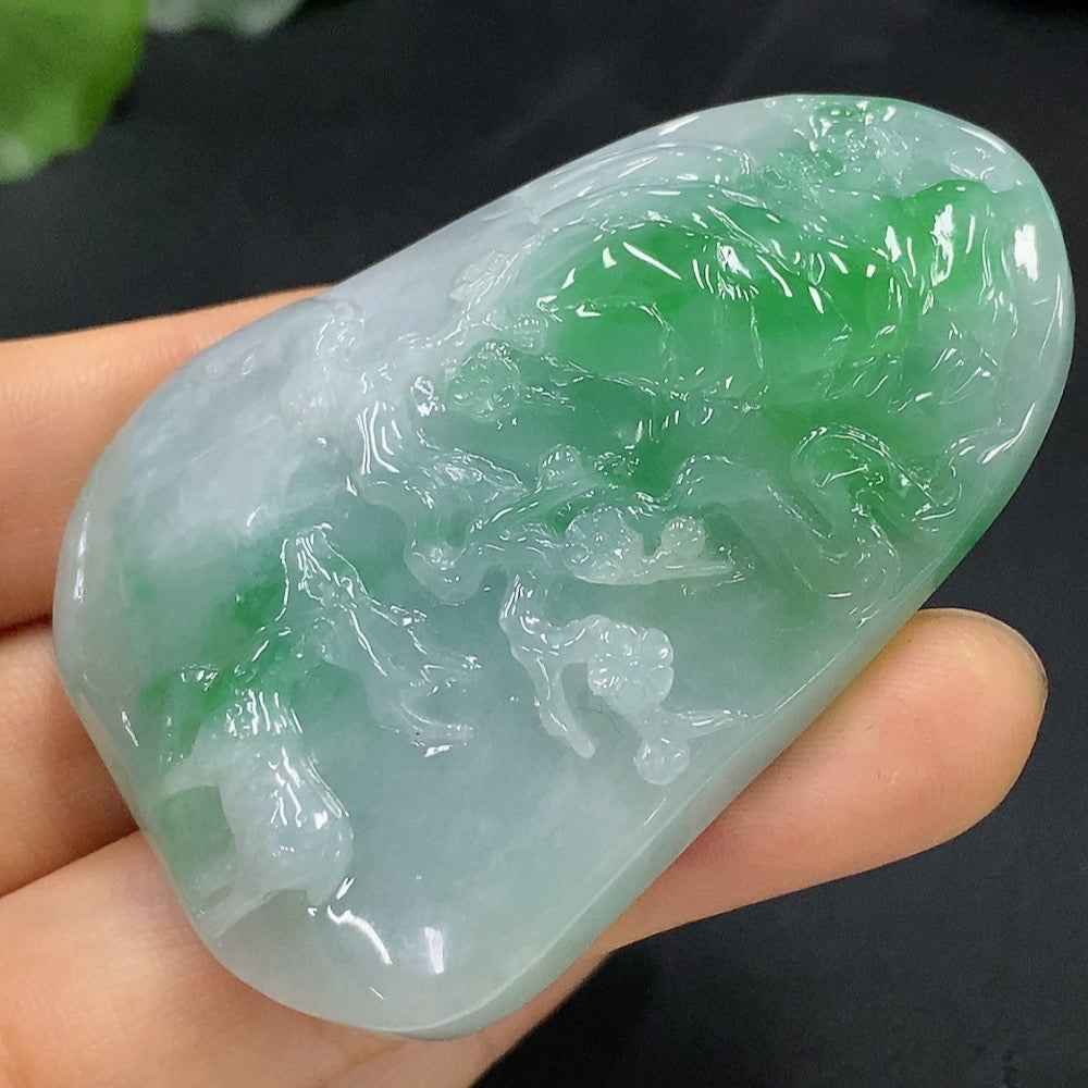 Jadeite deer pendant from HUILIU HQ, detailed green jade with natural smooth finish, weighs 60.587 grams.