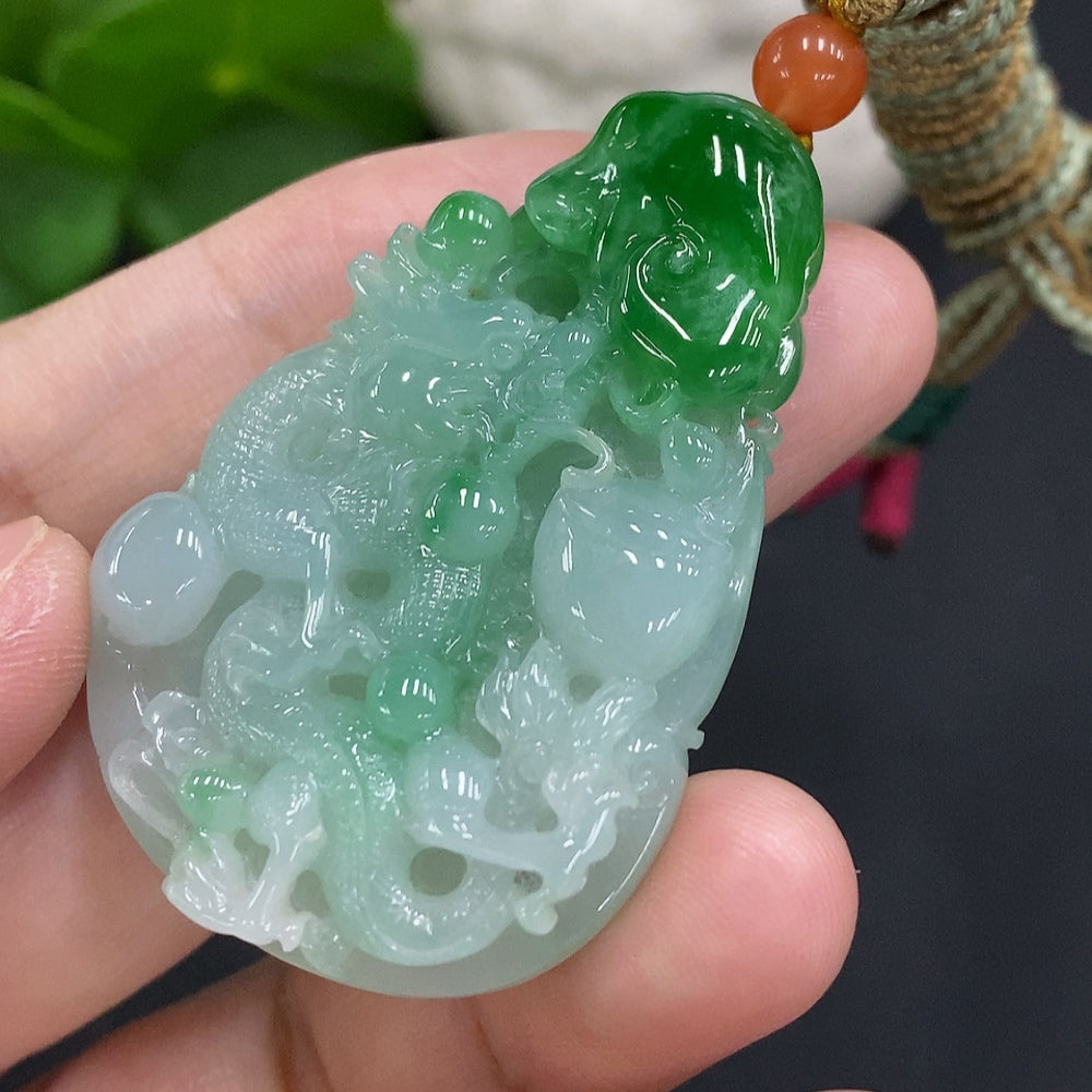 Jadeite dragon pendant with rope by HUILIU HQ, featuring detailed dragon carving, total weight 25.6g, made of smooth green jade.