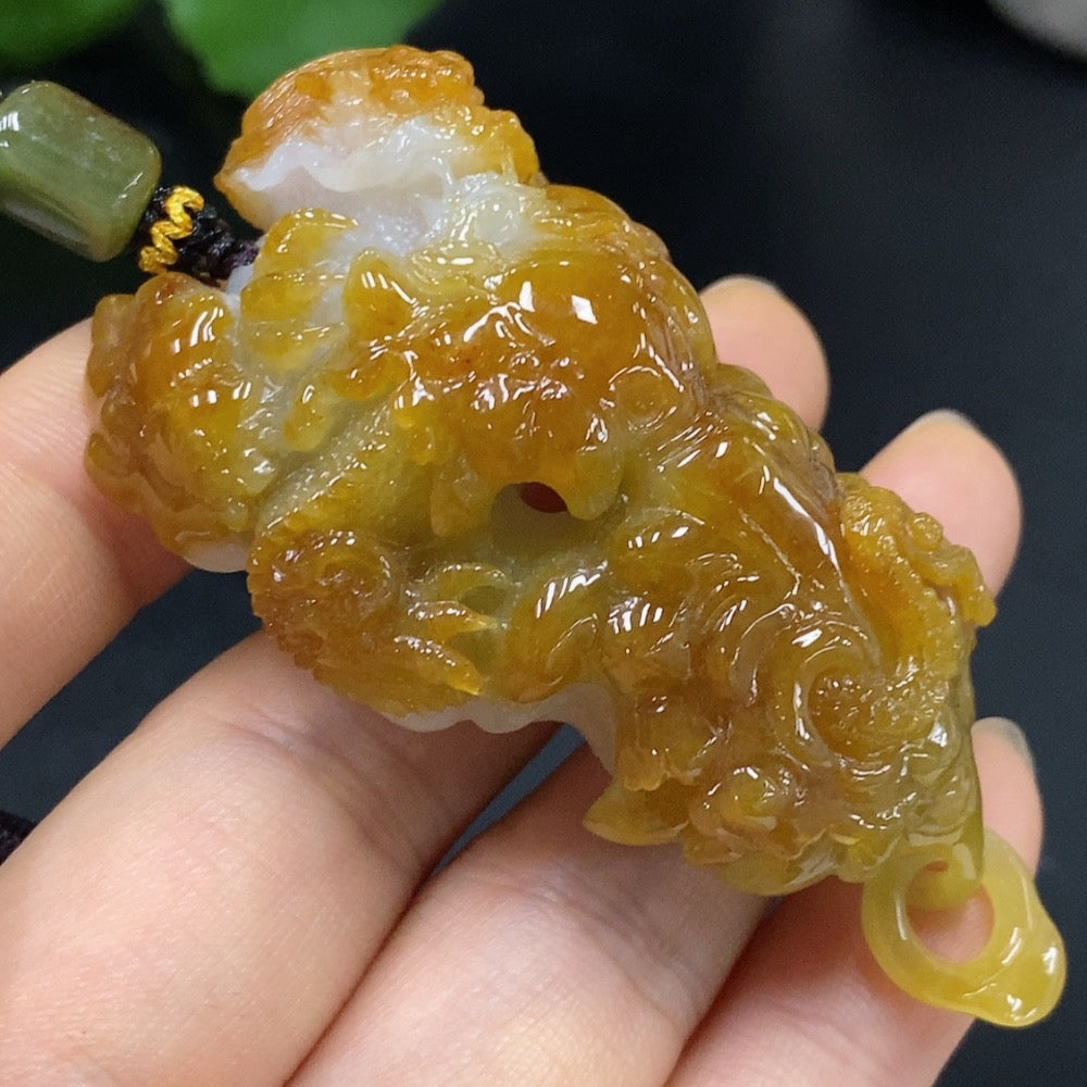 HUILIU HQ jadeite dragon pendant weighing approx. 67.51g with rope, featuring a green jade color and intricate dragon design.
