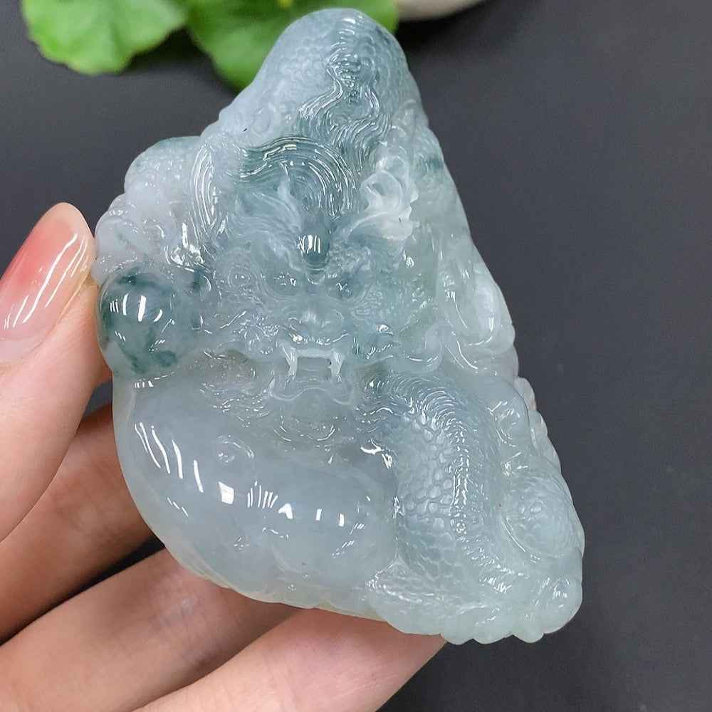 Jadeite Dragon Soaring the World pendant in jade, crafted by HUILIU HQ, weighing 90.993g with detailed dragon design.