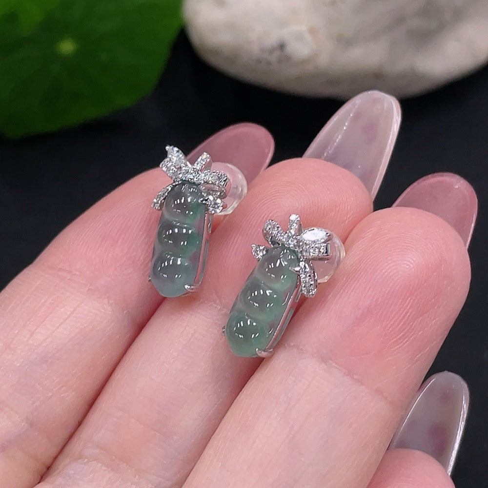 Huiliu certified jadeite earrings pair with large non-diamond stones, including ear studs, showcasing elegant green jade jewelry.