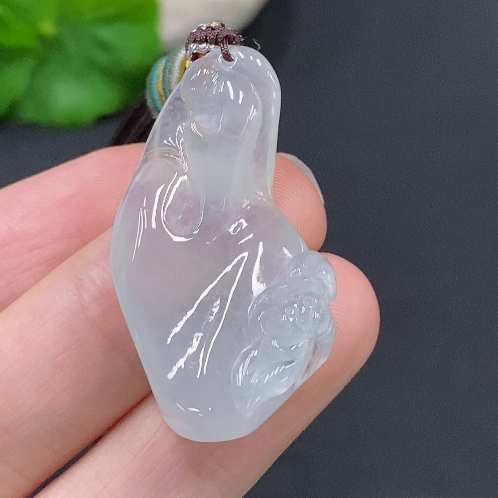 HUILIU HQ Jadeite Enlightenment Pendant featuring a polished green jade pendant with carved detailing, hanging on a silk cord.