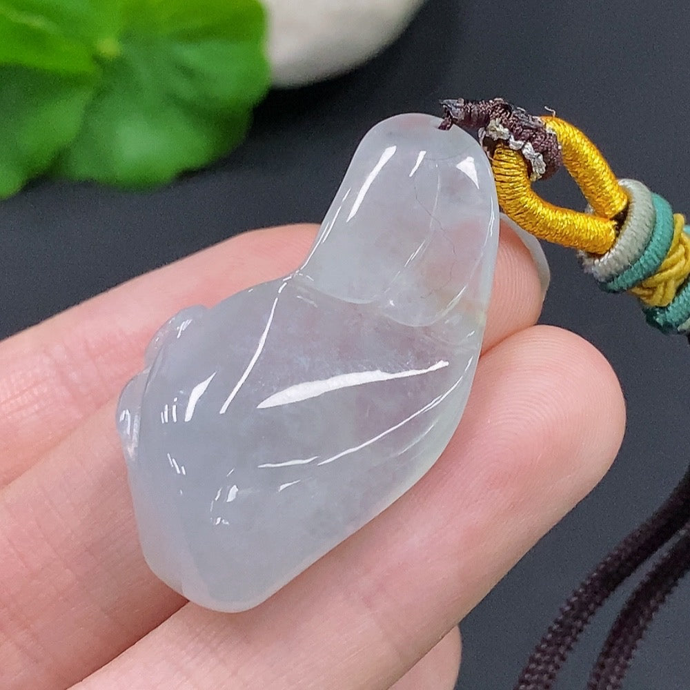 HUILIU HQ jadeite Enlightenment Pendant featuring smooth, polished green jade with natural variations and intricate carvings.