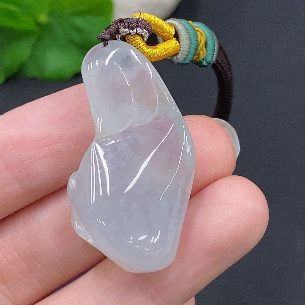 HUILIU HQ jadeite Enlightenment Pendant featuring a smooth, polished green jade pendant with intricate carvings and a cord necklace.