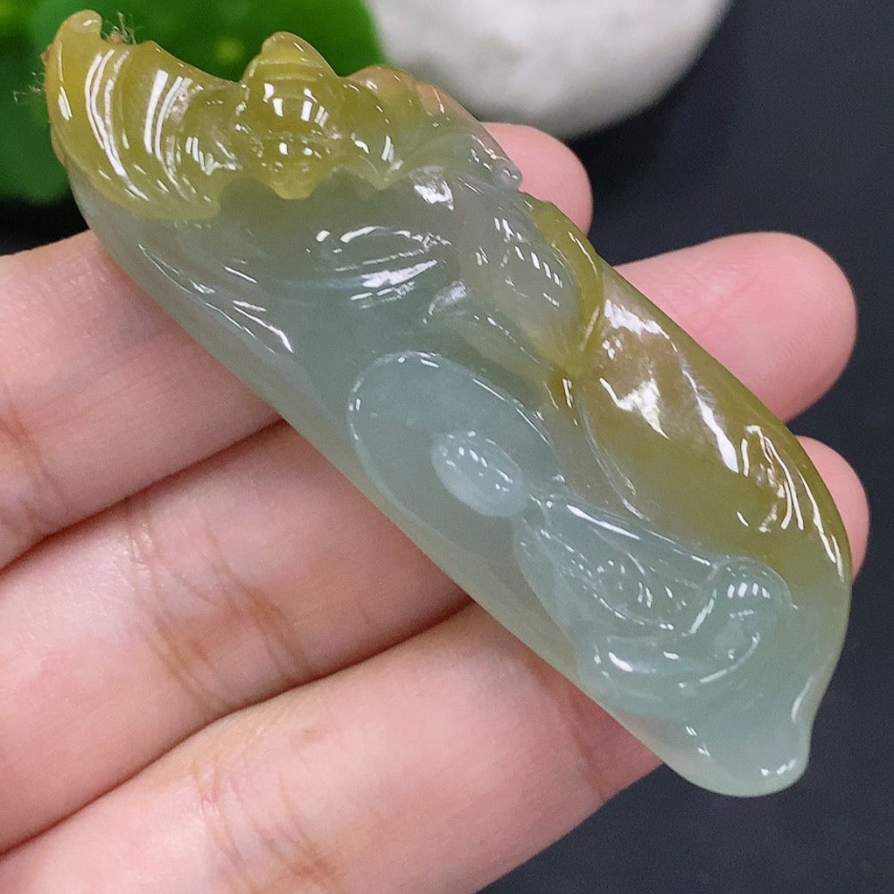 Jadeite Enlightenment Pendant by HUILIU HQ featuring a polished jade pendant with intricate carvings on a cord necklace.